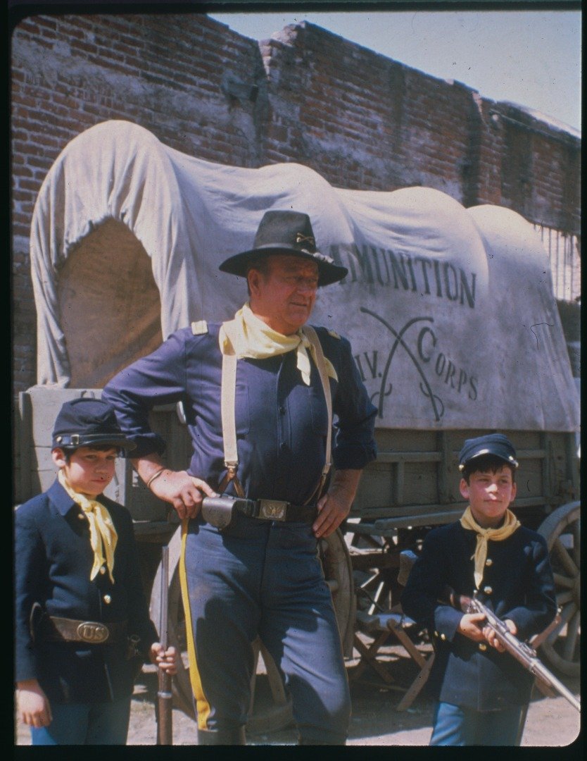 American actor John Wayne and his 8-year-old son John Ethan Wayne on set of Rio Lobo. | Source: Getty Images