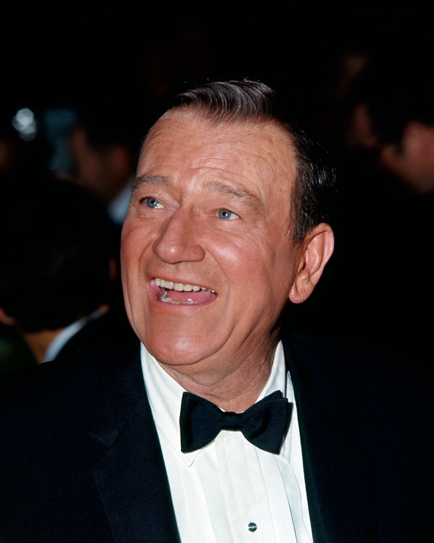 Close-up photo of American actor John Wayne in formal attire, at an unspecified event, late 1950s or 1960s. | Source: Getty Images